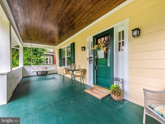 entrance to property featuring a porch