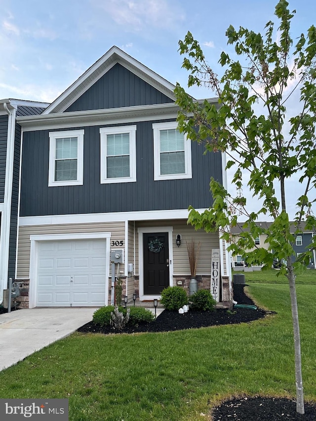 305 Maple Run Dr, York, PA 17404 - craftsman-style home featuring a front yard, a garage, driveway, stone siding, and board and batten siding