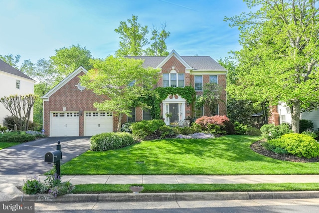 13757 Laurel Rock Dr, Clifton, VA 20124 - view of front of home featuring brick siding, driveway, a front lawn, and a garage