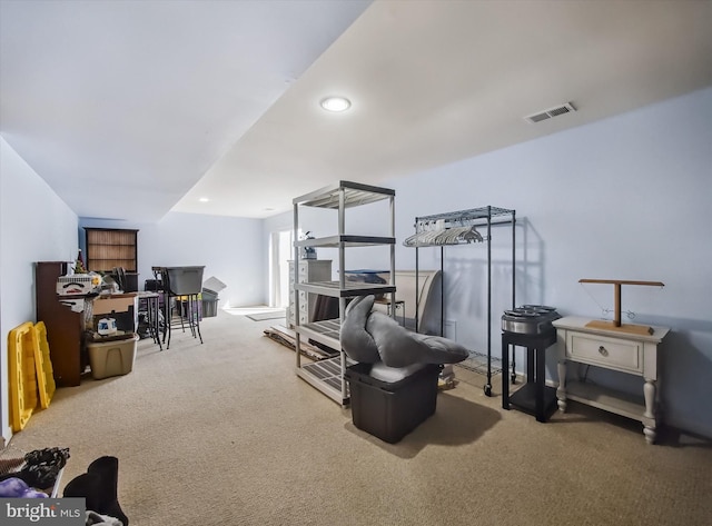 sitting room with carpet flooring and recessed lighting