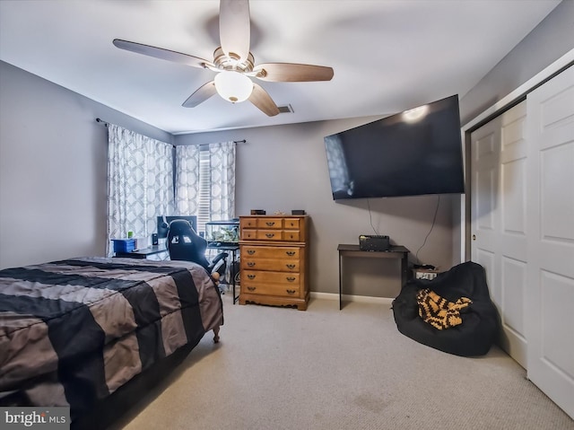 carpeted bedroom with ceiling fan