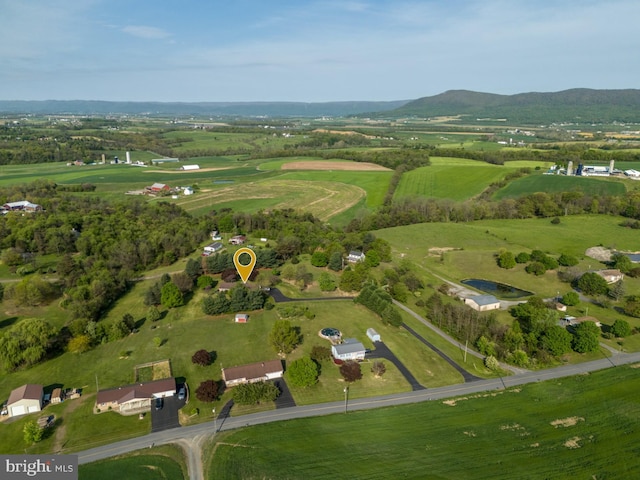 bird's eye view featuring a rural view and a mountain view