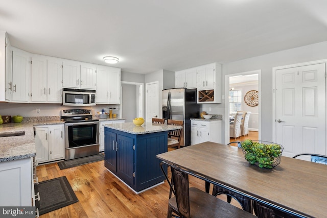 2994 Hope Mill Ln, Adamstown, MD 21710 - kitchen with white cabinets, appliances with stainless steel finishes, and blue cabinets