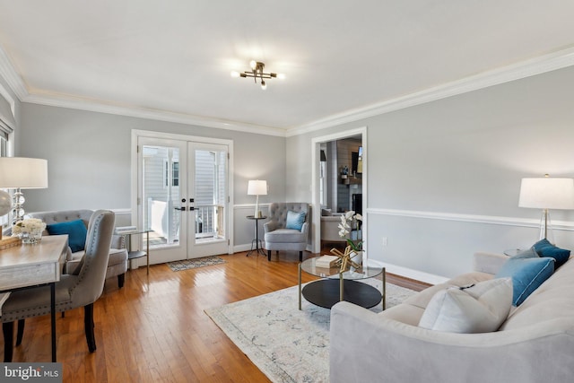 2994 Hope Mill Ln, Adamstown, MD 21710 - living room featuring crown molding, baseboards, french doors, and wood finished floors