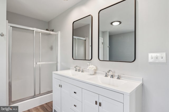 2994 Hope Mill Ln, Adamstown, MD 21710 - full bath with wood finished floors, double vanity, a sink, and a stall shower