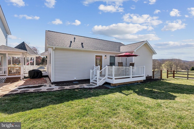 2994 Hope Mill Ln, Adamstown, MD 21710 - back of house featuring fence, a shingled roof, a yard, and a deck