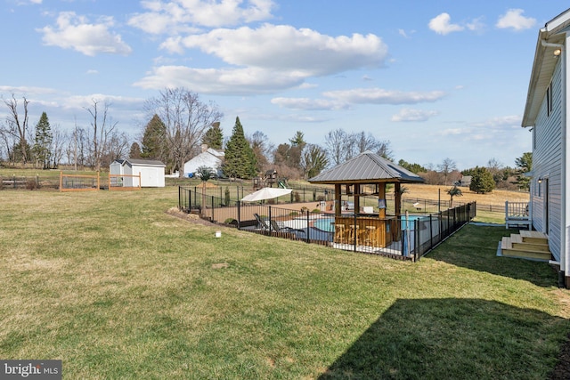 2994 Hope Mill Ln, Adamstown, MD 21710 - view of yard featuring fence, a storage unit, a fenced in pool, a gazebo, and an outbuilding