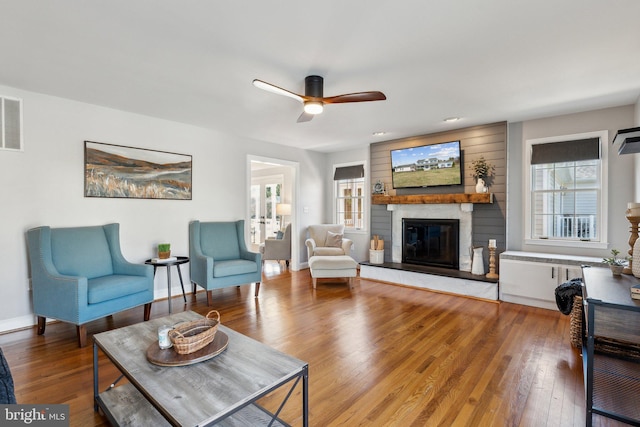 2994 Hope Mill Ln, Adamstown, MD 21710 - living room with a large fireplace, ceiling fan, baseboards, and wood finished floors