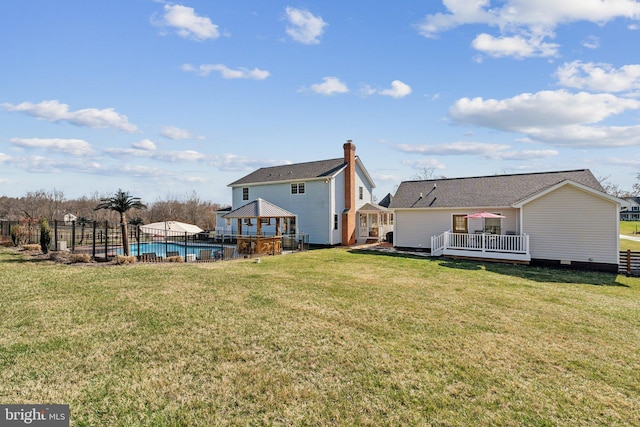 2994 Hope Mill Ln, Adamstown, MD 21710 - back of house with a fenced in pool, fence, a lawn, and a deck