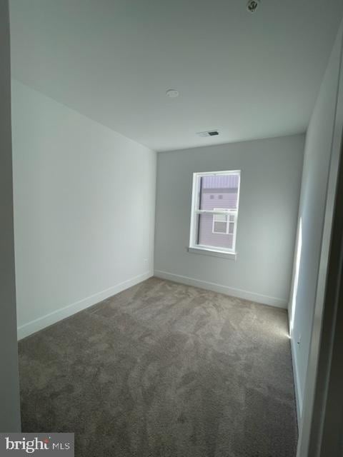 12 Mural Walk NE, Washington, DC 20011 - carpeted empty room featuring baseboards