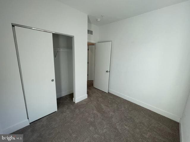 12 Mural Walk NE, Washington, DC 20011 - unfurnished bedroom with baseboards, visible vents, carpet, and a closet