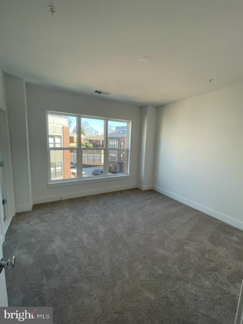 12 Mural Walk NE, Washington, DC 20011 - carpeted spare room featuring baseboards