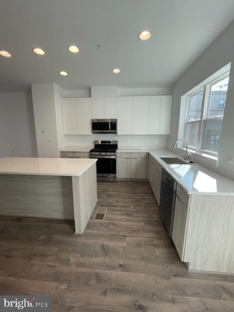 12 Mural Walk NE, Washington, DC 20011 - kitchen featuring recessed lighting, a sink, appliances with stainless steel finishes, and wood finished floors