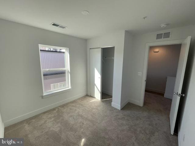 12 Mural Walk NE, Washington, DC 20011 - unfurnished bedroom featuring baseboards, carpet, a closet, and visible vents