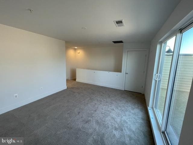 12 Mural Walk NE, Washington, DC 20011 - carpeted empty room with baseboards and visible vents