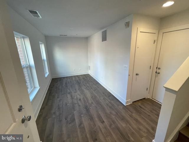 12 Mural Walk NE, Washington, DC 20011 - spare room featuring baseboards, dark wood-style floors, and visible vents