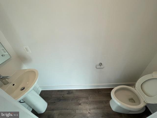 12 Mural Walk NE, Washington, DC 20011 - bathroom with toilet, baseboards, a sink, and wood finished floors