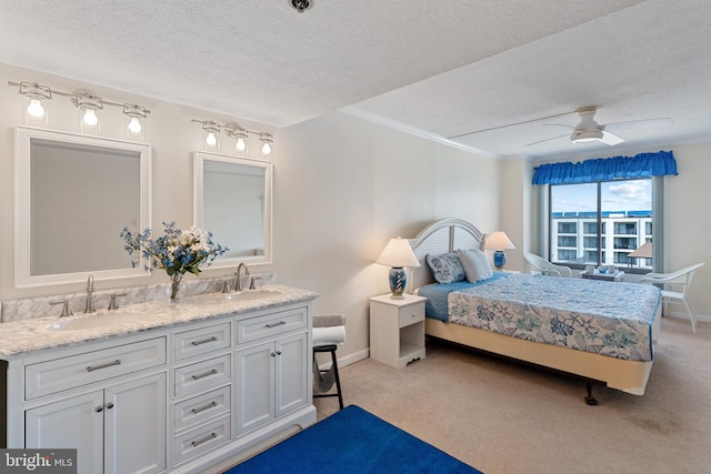 11 142nd St Unit 31003, Ocean City, MD 21842 - bedroom with a sink, a textured ceiling, light colored carpet, baseboards, and crown molding