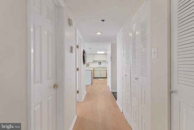 11 142nd St Unit 31003, Ocean City, MD 21842 - corridor with baseboards, light wood-type flooring, and recessed lighting