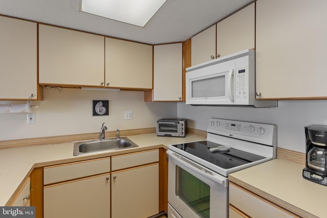 11 142nd St Unit 31003, Ocean City, MD 21842 - kitchen with white appliances, a sink, light countertops, and cream cabinets