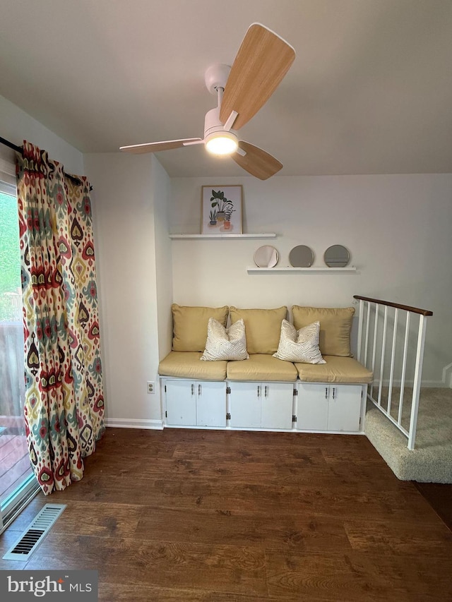 sitting room with visible vents, baseboards, ceiling fan, and dark wood-style floors