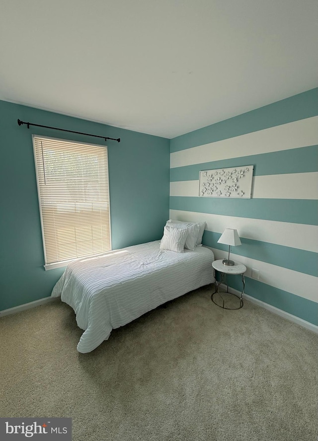 carpeted bedroom with baseboards