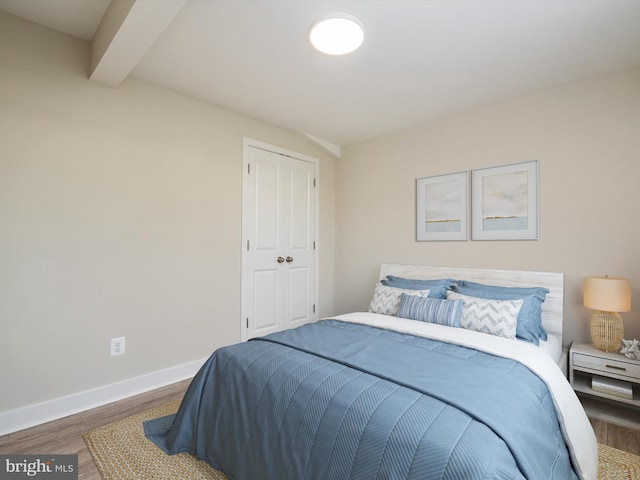 7847 Leymar Rd, Glen Burnie, MD 21060 - bedroom featuring wood finished floors, baseboards, and beam ceiling
