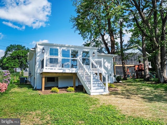 7847 Leymar Rd, Glen Burnie, MD 21060 - back of property with central AC unit, a yard, stairs, and a wooden deck