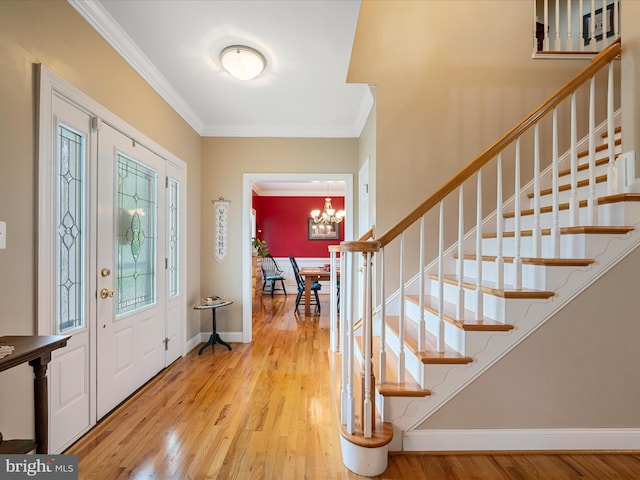 126 Boydton Plank Dr, Stephens City, VA 22655 - entryway with wood finished floors, baseboards, stairway, crown molding, and a notable chandelier