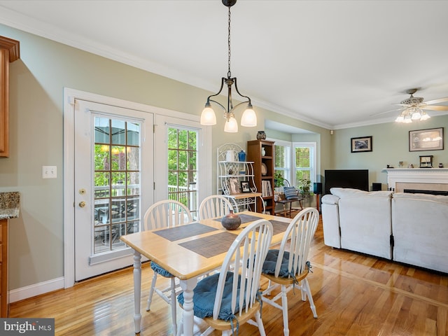126 Boydton Plank Dr, Stephens City, VA 22655 - dining room featuring baseboards, ornamental molding, light wood-style flooring, and plenty of natural light