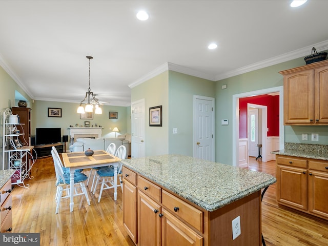 126 Boydton Plank Dr, Stephens City, VA 22655 - kitchen with light stone counters, light wood finished floors, open floor plan, and crown molding