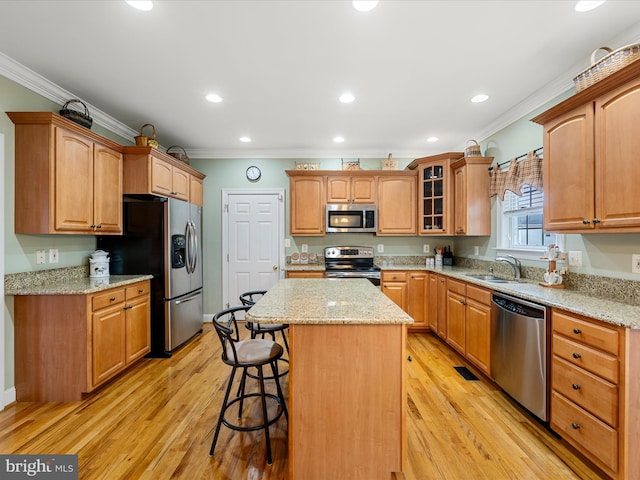 126 Boydton Plank Dr, Stephens City, VA 22655 - kitchen with a sink, a kitchen bar, crown molding, a kitchen island, and appliances with stainless steel finishes