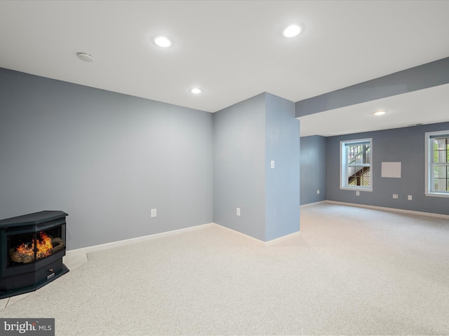 126 Boydton Plank Dr, Stephens City, VA 22655 - basement with baseboards, a wood stove, recessed lighting, and light colored carpet