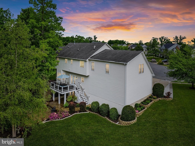 126 Boydton Plank Dr, Stephens City, VA 22655 - back of property featuring a lawn, a shingled roof, a wooden deck, and stairs
