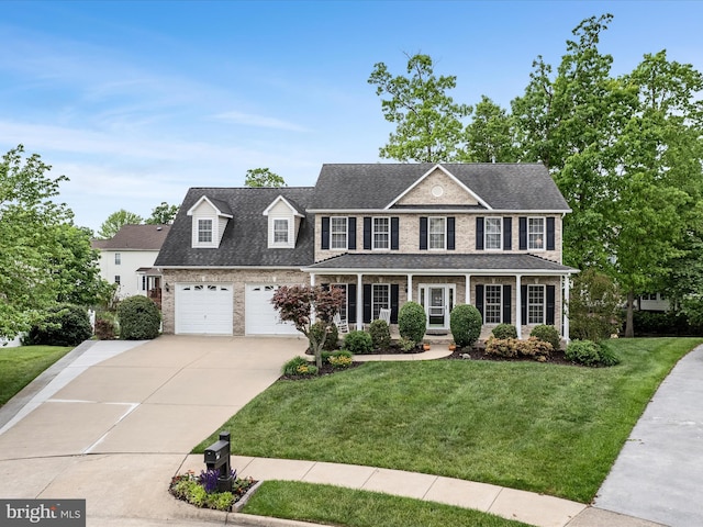126 Boydton Plank Dr, Stephens City, VA 22655 - colonial house featuring brick siding, concrete driveway, a garage, a front yard, and a shingled roof