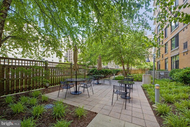 view of patio featuring fence