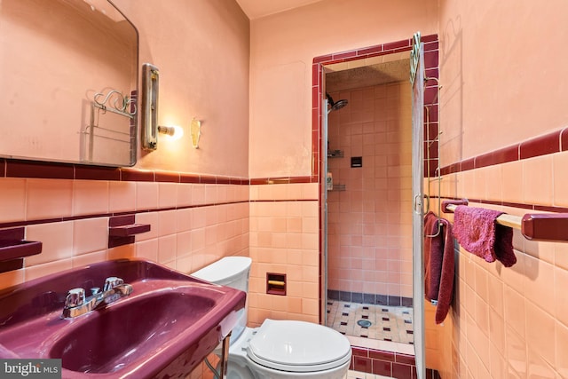 5766 W Jefferson St, Philadelphia, PA 19131 - bathroom with tile walls, toilet, and a stall shower