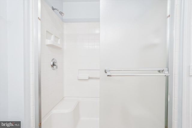 full bathroom featuring a shower stall