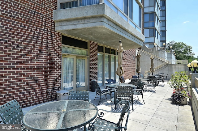 view of patio featuring outdoor dining area