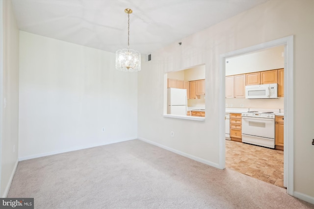 unfurnished dining area with light colored carpet, a notable chandelier, and baseboards