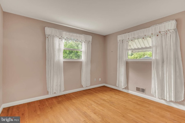 586 Rita Dr, Odenton, MD 21113 - empty room featuring baseboards, plenty of natural light, and wood finished floors