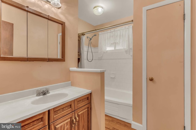 586 Rita Dr, Odenton, MD 21113 - bathroom featuring tub / shower combination, vanity, and wood finished floors