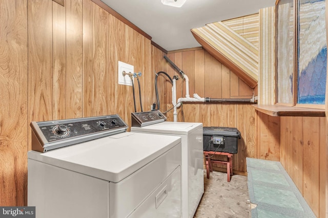 586 Rita Dr, Odenton, MD 21113 - clothes washing area with wood walls and washer and clothes dryer