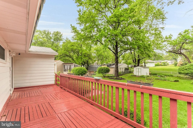586 Rita Dr, Odenton, MD 21113 - wooden deck featuring a storage unit and an outdoor structure