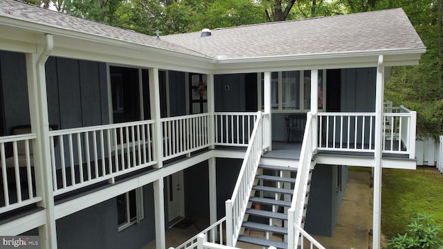 115 Carnoustie Rd, Dover, DE 19904 - exterior space featuring roof with shingles, stairs, and board and batten siding