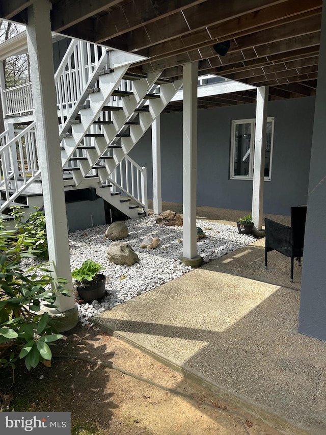 115 Carnoustie Rd, Dover, DE 19904 - view of patio featuring stairway