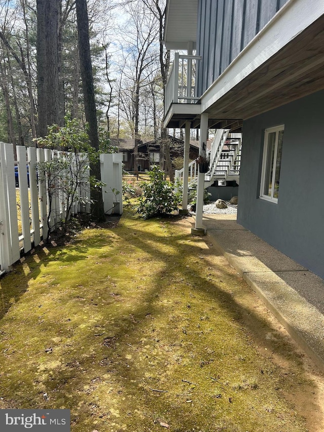 115 Carnoustie Rd, Dover, DE 19904 - view of yard featuring stairs, fence, and a deck