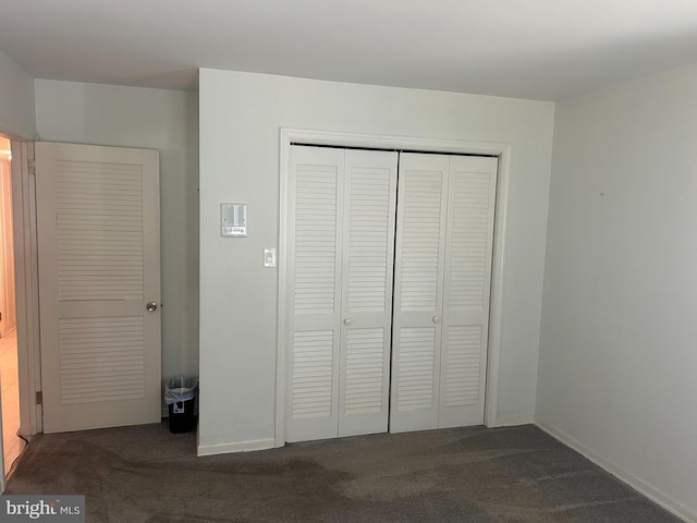 115 Carnoustie Rd, Dover, DE 19904 - unfurnished bedroom featuring carpet flooring, a closet, and baseboards