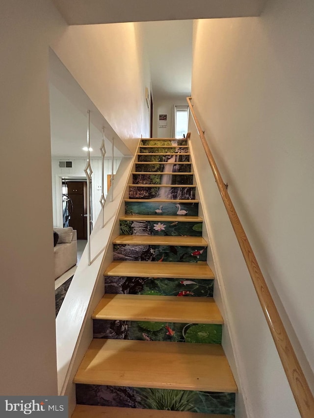115 Carnoustie Rd, Dover, DE 19904 - stairway featuring visible vents and a towering ceiling