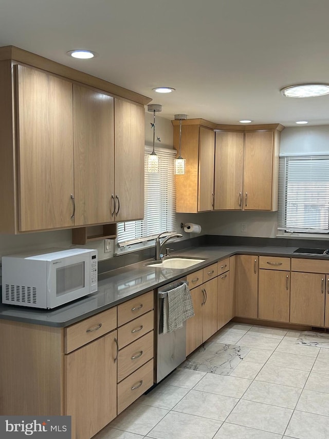 115 Carnoustie Rd, Dover, DE 19904 - kitchen with dishwasher, dark countertops, a sink, and white microwave